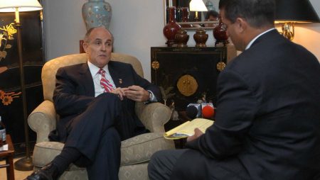 Mr. Castellanos discussing matters of importance with Mayor Giuliani